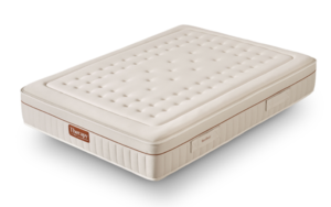 Colchón Therapy de Gomarco con acolchado beige, laterales con costuras verticales y asas